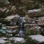 waterfalls surrounded with rock formations