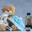 brown bear plush toy on blue textile
