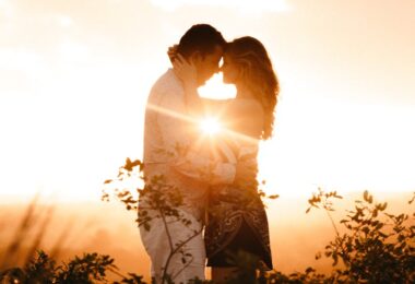 Couple Standing Beside Plants during Golden Hour
