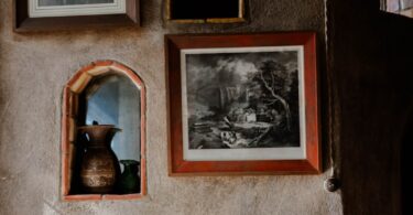 A room that has a bunch of pictures on the wall