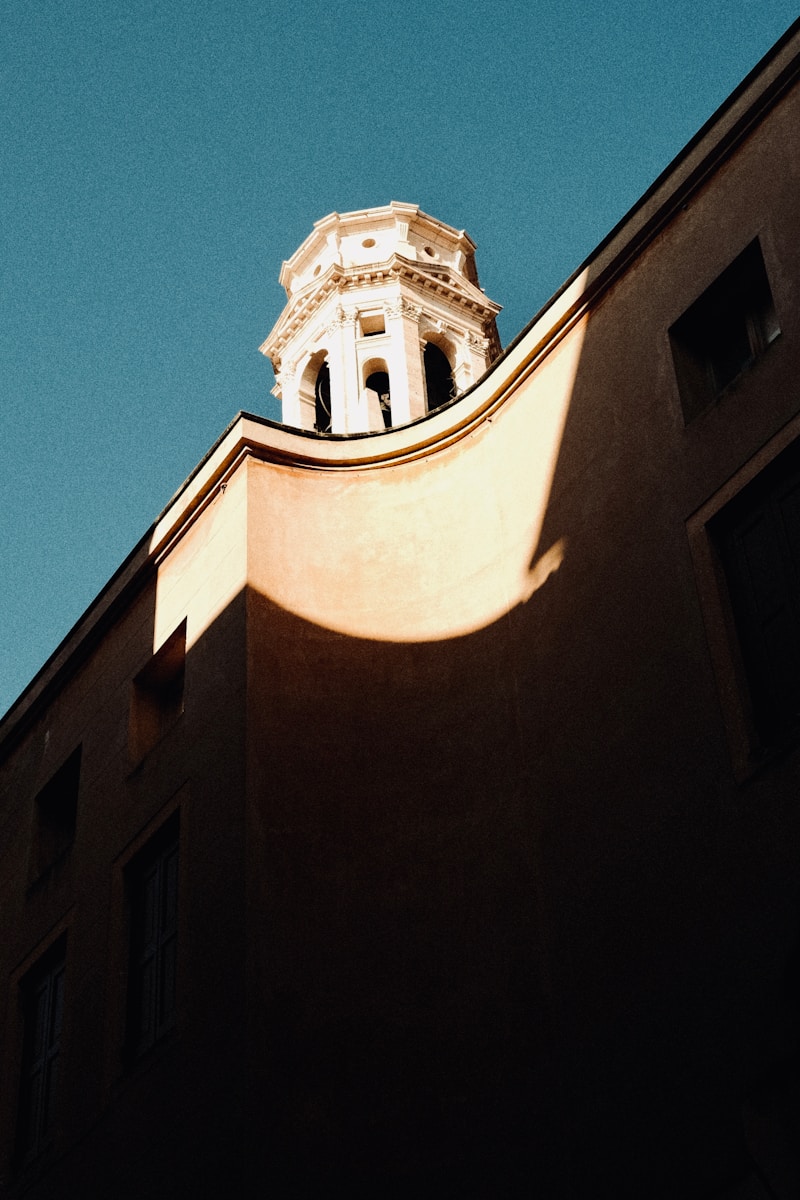 The building has a church tower in the background.