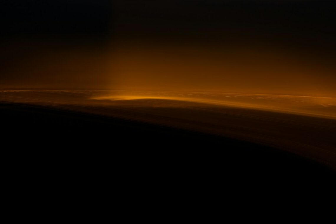 Clouds illuminated by a golden light glow.