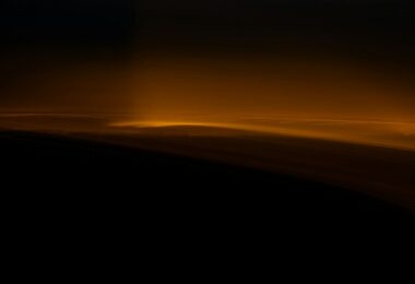 Clouds illuminated by a golden light glow.
