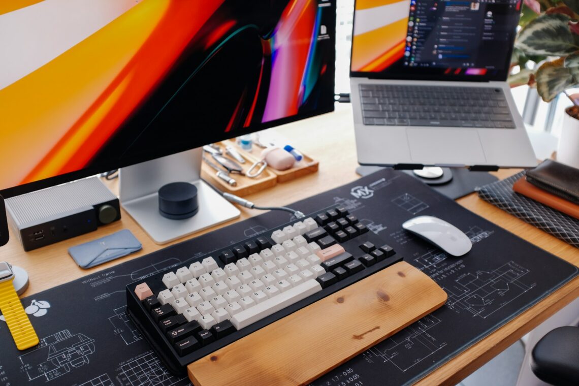 A modern desk setup with a keyboard and monitor.