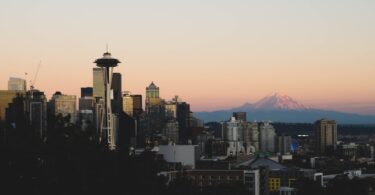 City skyline with space needle at sunset