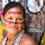 Native Brazilian woman portrait at an indigenous tribe in the Amazon